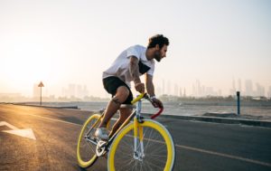 bicyclist on yellow bike