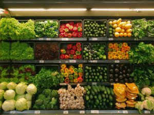 produce on the shelf at a grocery store