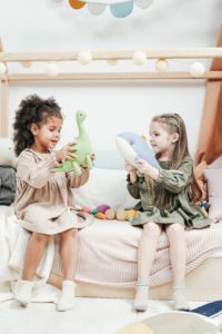 children playing with stuffed animals