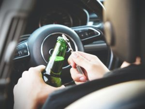opening drink while driving