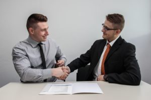 shaking hands with client