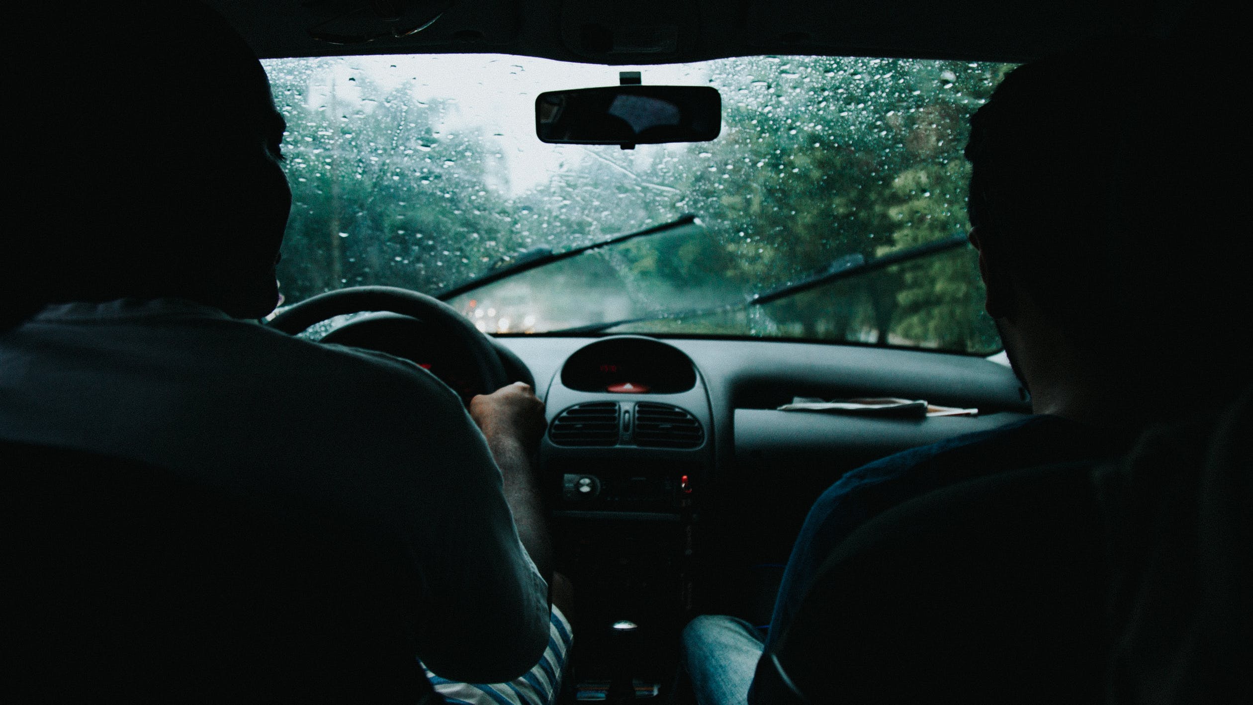 person driving in the rain