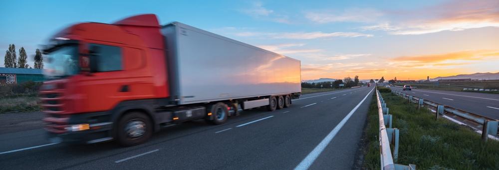 truck on road at the sunset