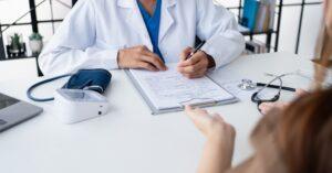 Healthcare. Doctor and patient are discussing interview consulting patient.