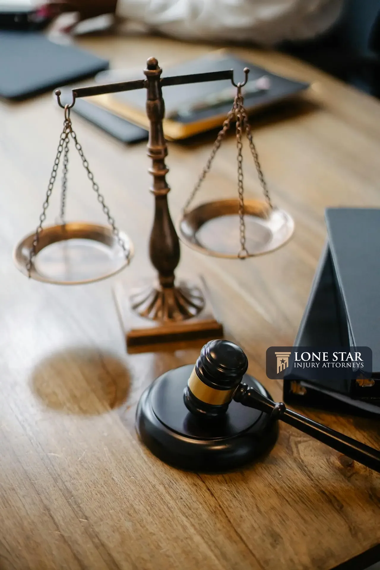 Scales of justice and a judge’s gavel on a desk, symbolizing law, fairness, and legal proceedings.
